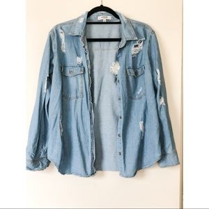 Distressed denim shirt.